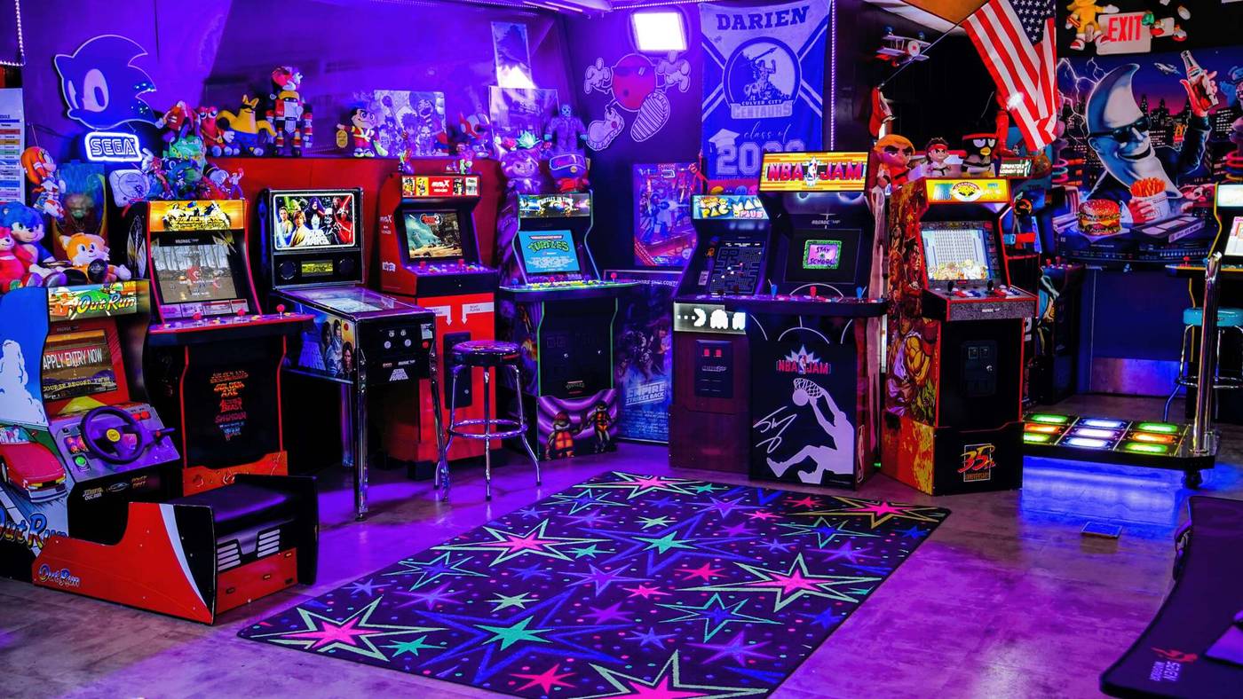 Arcade cabinets glowing in the Dojo